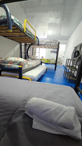 a group of bunk beds in a room at Mom's house Colombia in Cali