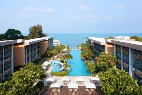 an aerial view of a resort with a swimming pool at Renaissance Pattaya Resort & Spa in Na Jomtien
