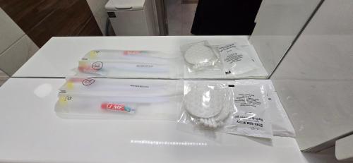 a white table with three plastic containers on it at Порт сіті,Там Там,Автостанція in Luts'k