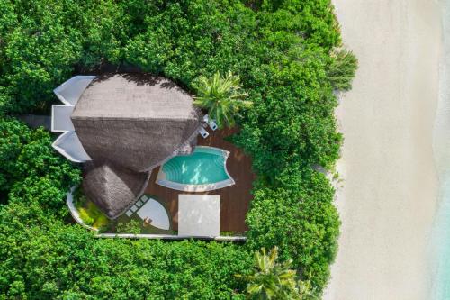 an overhead view of a resort surrounded by trees at JW Marriott Maldives Resort & Spa in Funadhoo