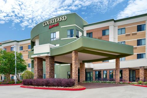 a rendering of the front of a hotel at Courtyard by Marriott Houston NASA Clear Lake in Nassau Bay