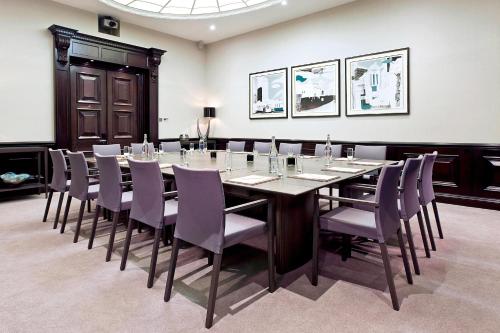 a conference room with a long table and chairs at Threadneedles, Autograph Collection in London