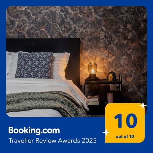 a bedroom with a bed with a yellow sign that says travel review awards at Old Town by Humpback in Craiova