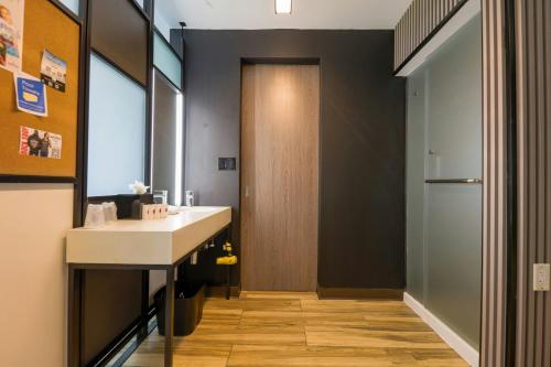 a bathroom with a sink and a mirror at Aloft Ponce Hotel & Casino in Ponce