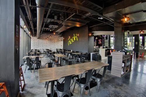 a restaurant with tables and chairs in a room at Aloft Ponce Hotel & Casino in Ponce