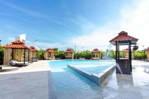 a pool at a resort with a water park at Aloft Ponce Hotel & Casino in Ponce