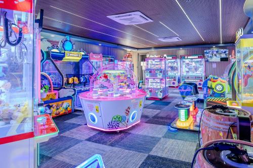 a room with many arcade games in it at Aloft Ponce Hotel & Casino in Ponce