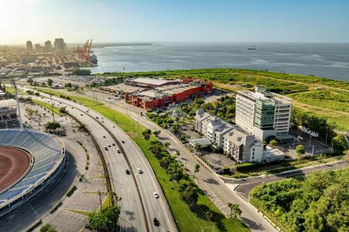 an aerial view of a city with a highway at Courtyard by Marriott Port of Spain in Port-of-Spain