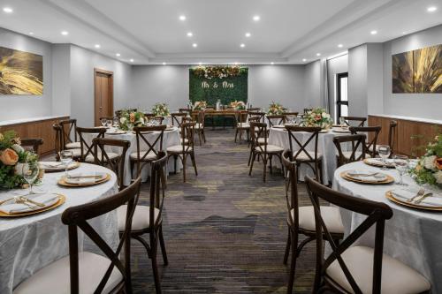 a set up banquet room with tables and chairs at Courtyard by Marriott Port of Spain in Port-of-Spain