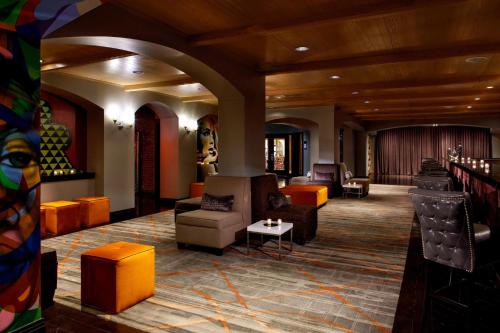 a lobby with couches and chairs in a building at Renaissance Reno Downtown Hotel & Spa in Reno