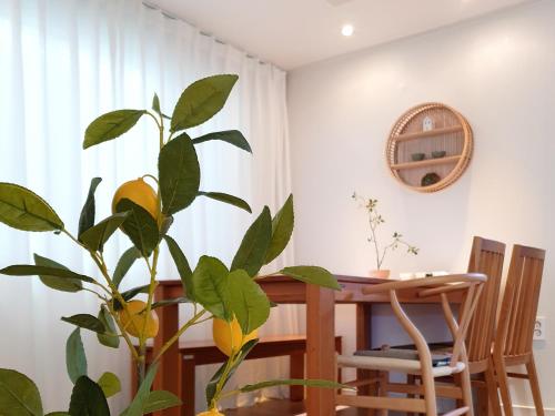 a dining room with a table and a plant at Dal126 House Seoul in Seoul