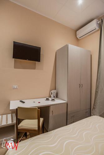 Postel nebo postele na pokoji v ubytování Hotel Moderno