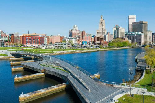 a bridge over a river with a city in the background at Aloft Providence Downtown in Providence