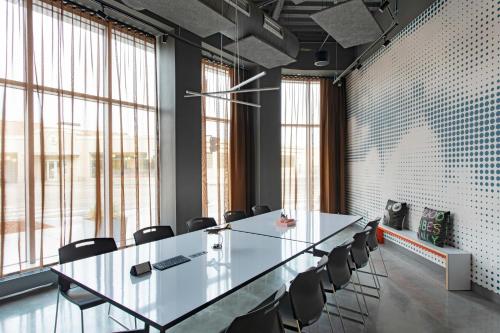 a conference room with a long table and chairs at Aloft Providence Downtown in Providence