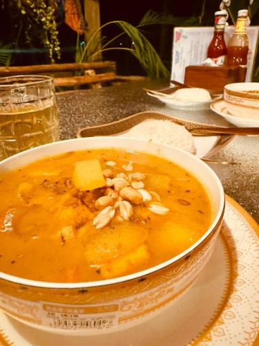 a bowl of soup sitting on a table at Sea Views bungalow kohrong in Koh Rong Island
