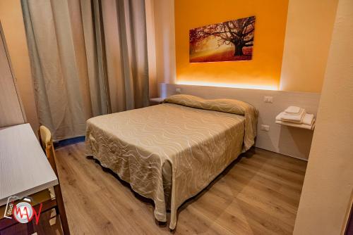 Postel nebo postele na pokoji v ubytování Hotel Moderno