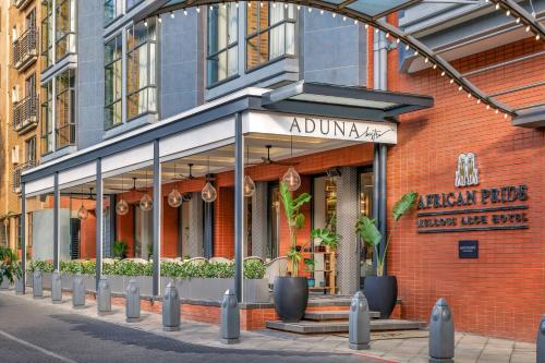 a store front of a brick building at African Pride Melrose Arch, Autograph Collection in Johannesburg