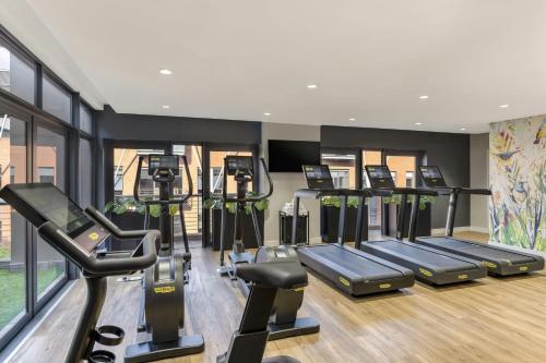 a gym with several treadmills and elliptical machines at African Pride Melrose Arch, Autograph Collection in Johannesburg