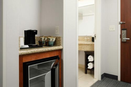 a kitchen with a counter with a coffee maker at Courtyard by Marriott Boone in Boone