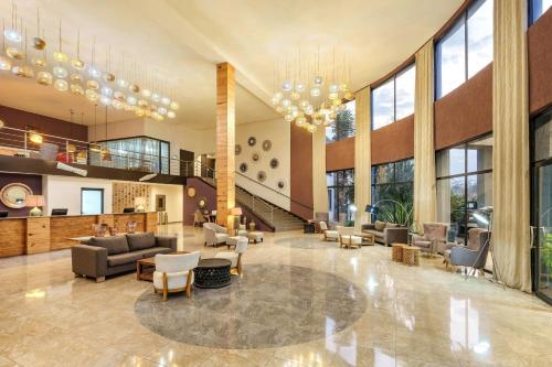 a large lobby with couches and chairs at Protea Hotel by Marriott Ndola in Ndola