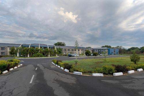 an empty road in front of a building at Protea Hotel by Marriott Ndola in Ndola