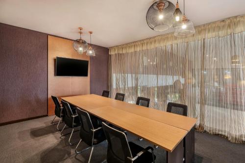 a conference room with a large table and chairs at Protea Hotel by Marriott Ndola in Ndola
