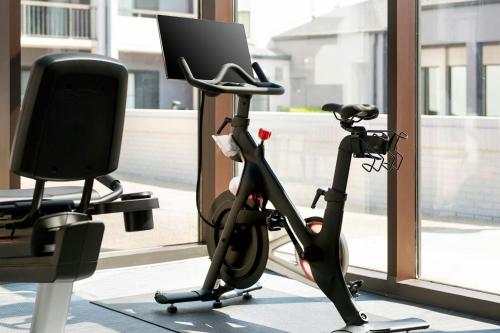 an exercise bike in a room with a computer at Courtyard by Marriott Rye in Rye