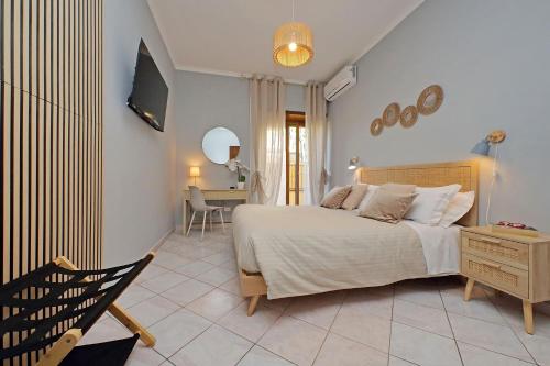Ένα ή περισσότερα κρεβάτια σε δωμάτιο στο PORTUNUS APARTMENT FIUMICINO ROME AIRPORT 10 Min
