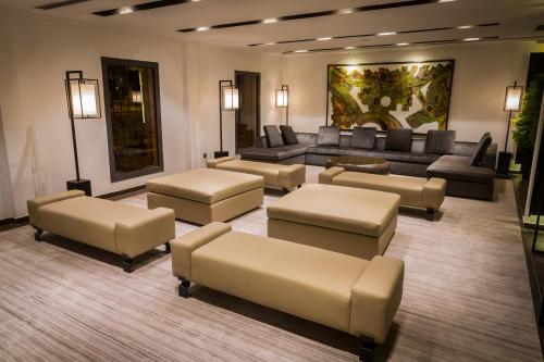 a living room with couches and couches at Azalaï Hôtel Nouakchott in Nouakchott