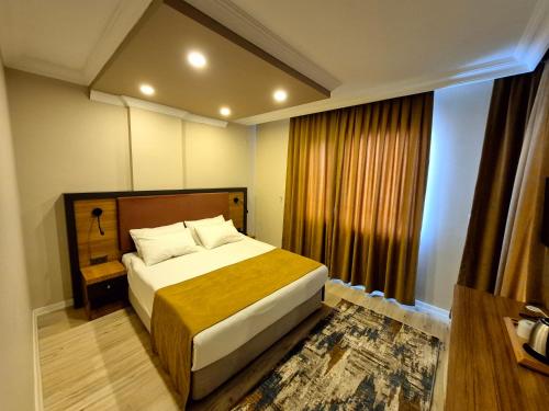 Katil atau katil-katil dalam bilik di Toprak Apart Otel