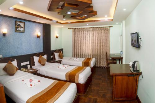 Katil atau katil-katil dalam bilik di Samsara Boutique Hotel