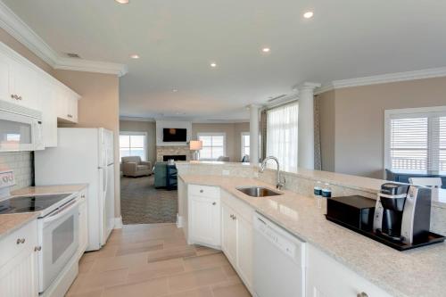 a kitchen with a sink and a counter top at Inn at Bay Harbor, Autograph Collection in Petoskey