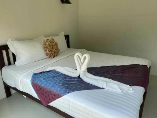 Postel nebo postele na pokoji v ubytování Nai C Resort