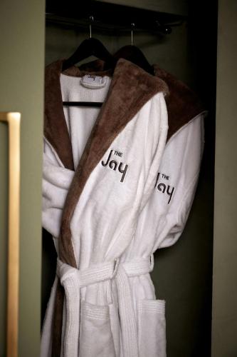 a group of white towels on a rack at The Jay, Autograph Collection in San Francisco