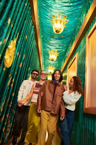 a group of people standing in a room with a blue ceiling at W Prague in Prague