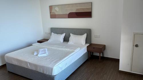 Ένα ή περισσότερα κρεβάτια σε δωμάτιο στο Carnelian Tower Hotel at Forestcity 4123 with WIFI