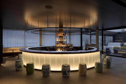 a lobby with a table with a cake on it at Roomers Baden-Baden, Autograph Collection in Baden-Baden
