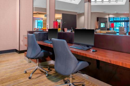 an office with two chairs and a desk with a computer at Courtyard by Marriott Killeen in Killeen