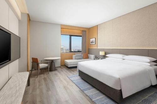 Sheraton Pujiangにあるベッド