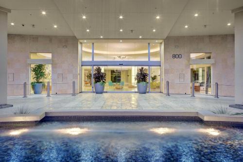 a pool in the lobby of a hotel at Pier South Resort, Autograph Collection in Imperial Beach