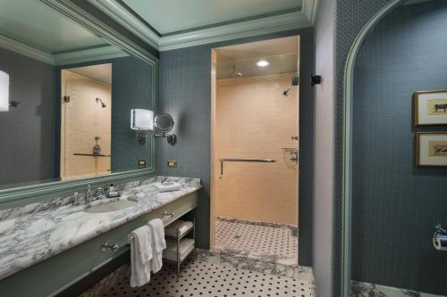 a bathroom with a large sink and a shower at Hotel ICON, Autograph Collection in Houston