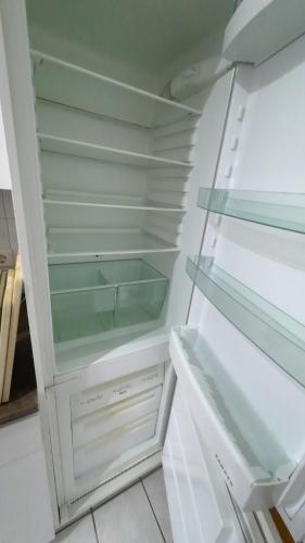 a white refrigerator with its door open with its at Sea Lounge in Eckernförde