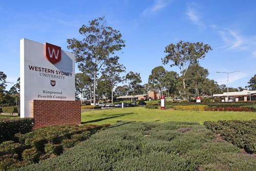 a sign for a western super hospital in a park at Blue Haven Retreat - Thornton Central 60 in Penrith