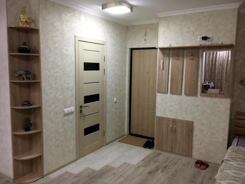 an empty living room with a door and a room with at Apartment for rent number 1 in Aktau