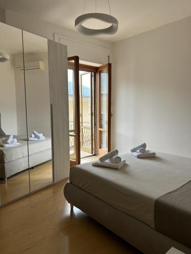 a bedroom with a bed and a large mirror at La Casa Del Matese in Piedimonte dʼAlife