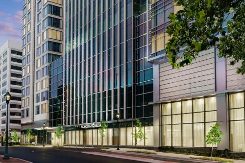 a rendering of a tall building with a street at AC Hotel by Marriott Bethesda Downtown in Bethesda