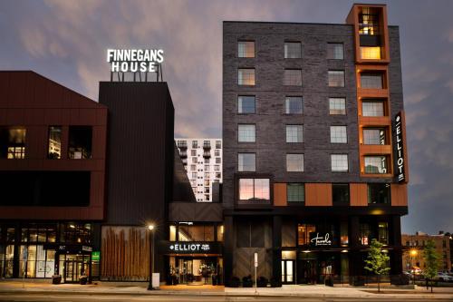 a building with a sign on the side of it at Elliot Park Hotel, Autograph Collection in Minneapolis