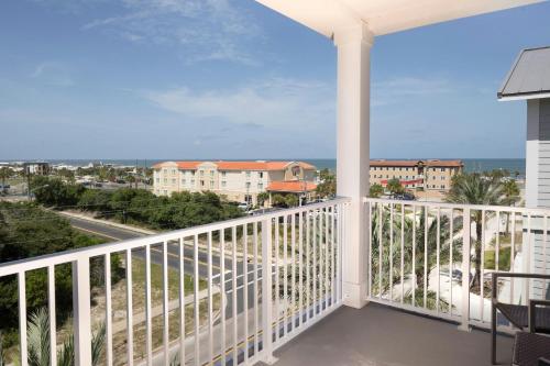a balcony with a view of the ocean at Courtyard Amelia Island in Amelia Island