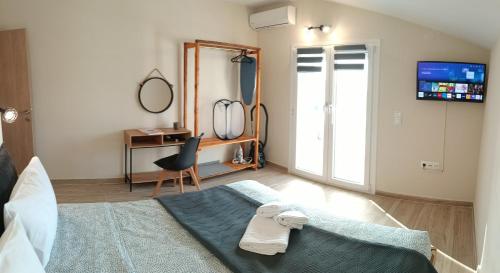 Olive Waves apartmentsにあるベッド