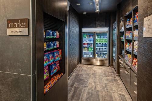 a drink aisle in a grocery store with drinks at Courtyard by Marriott Dulles Airport Herndon in Herndon